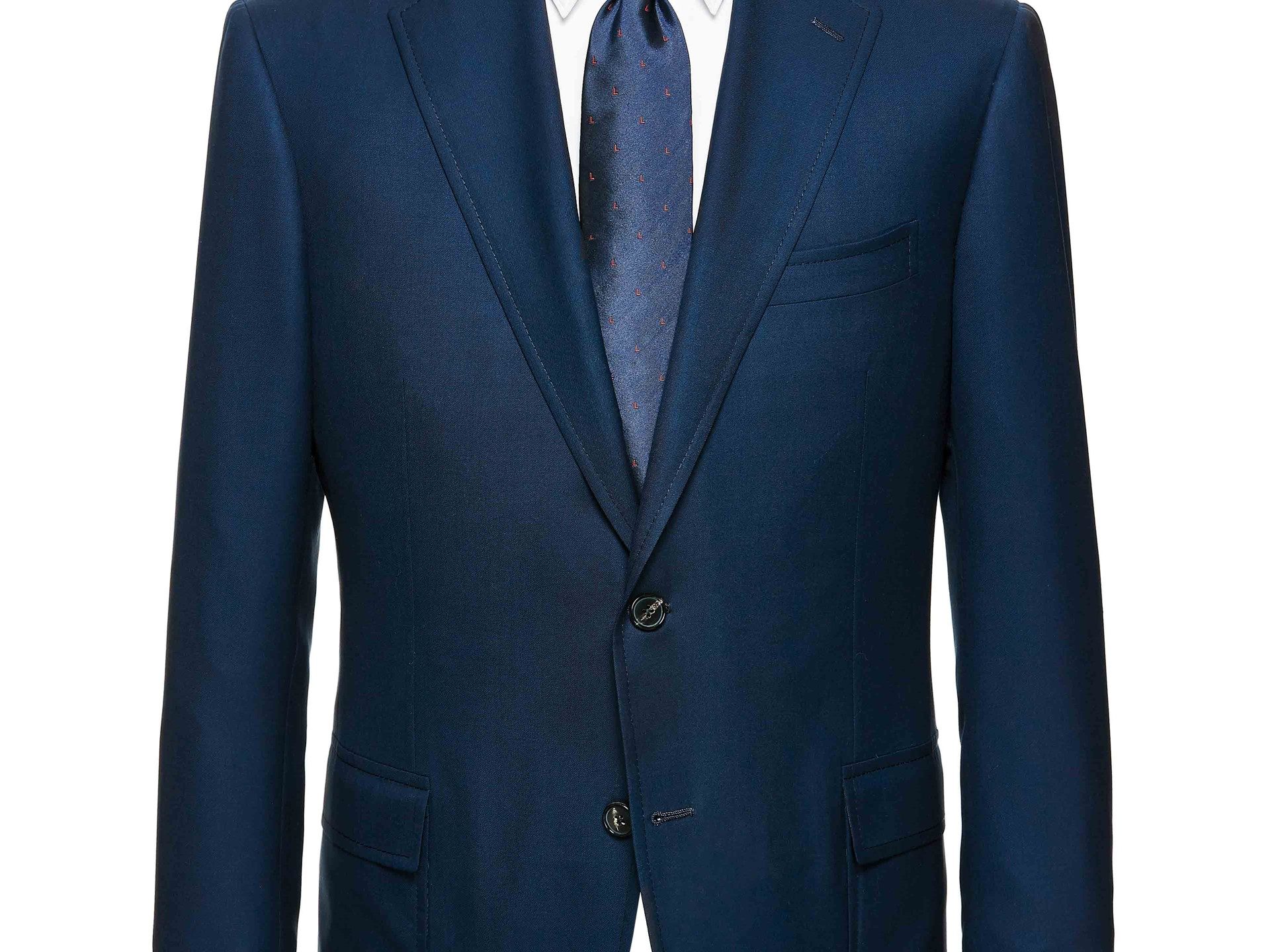 Close-up of Lamborghini d'Avenza dark blue suit jacket showing classic two-button design with notched lapels and a silk tie with red L-pattern branding