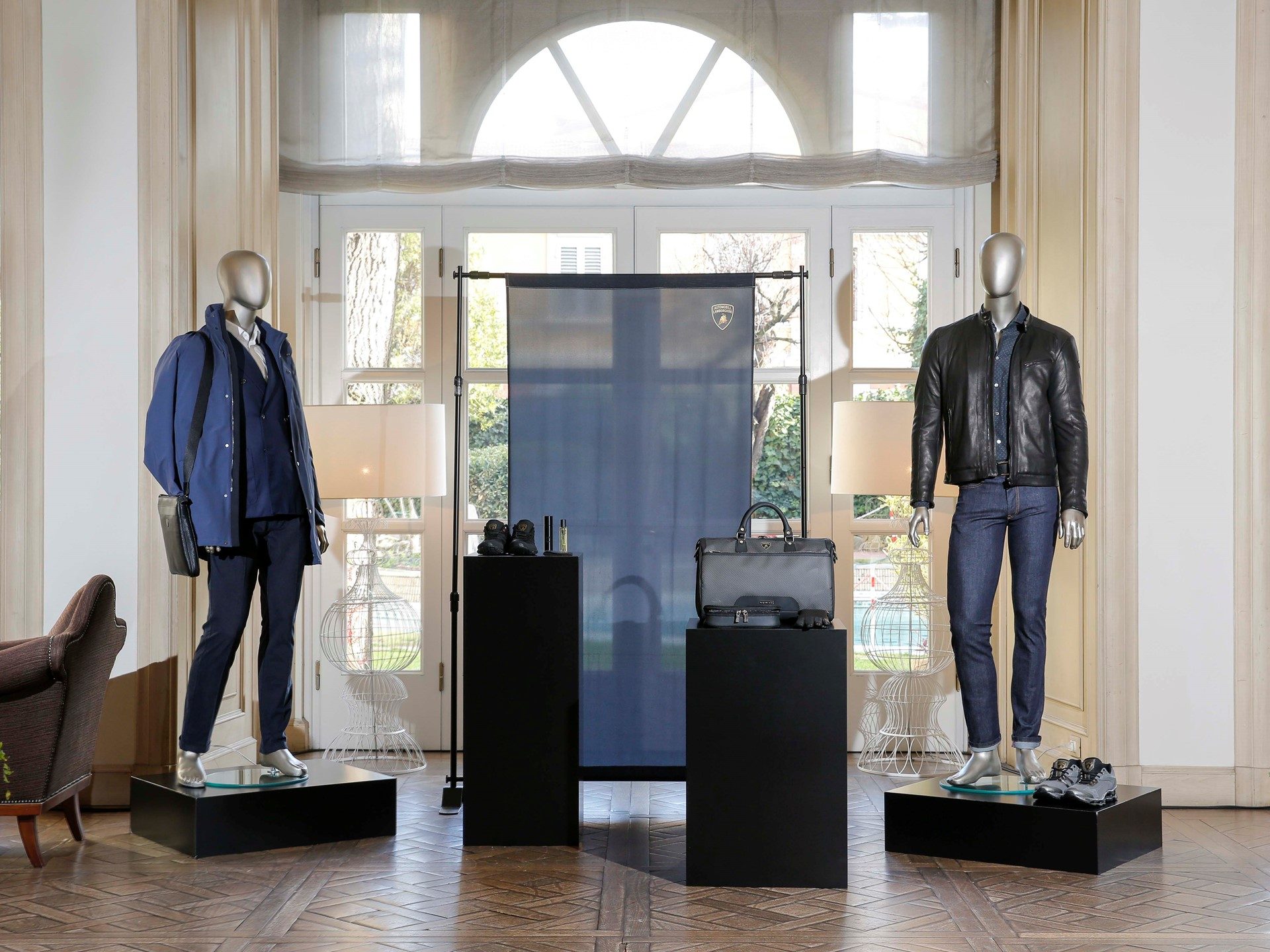 Mannequins displaying blue and black Lamborghini Fall-Winter 2016-17 apparel with clean lines and modern styling