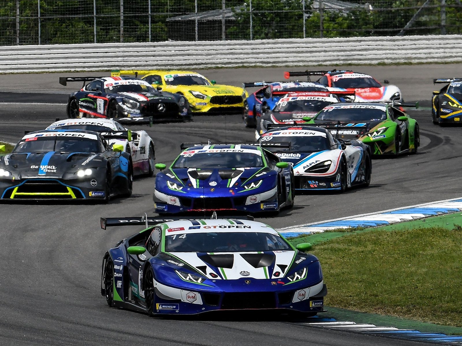 Lamborghini Huracán GT3 EVO race cars in Team Emil Frey Racing livery competing at the International GT Open at Hockenheimring