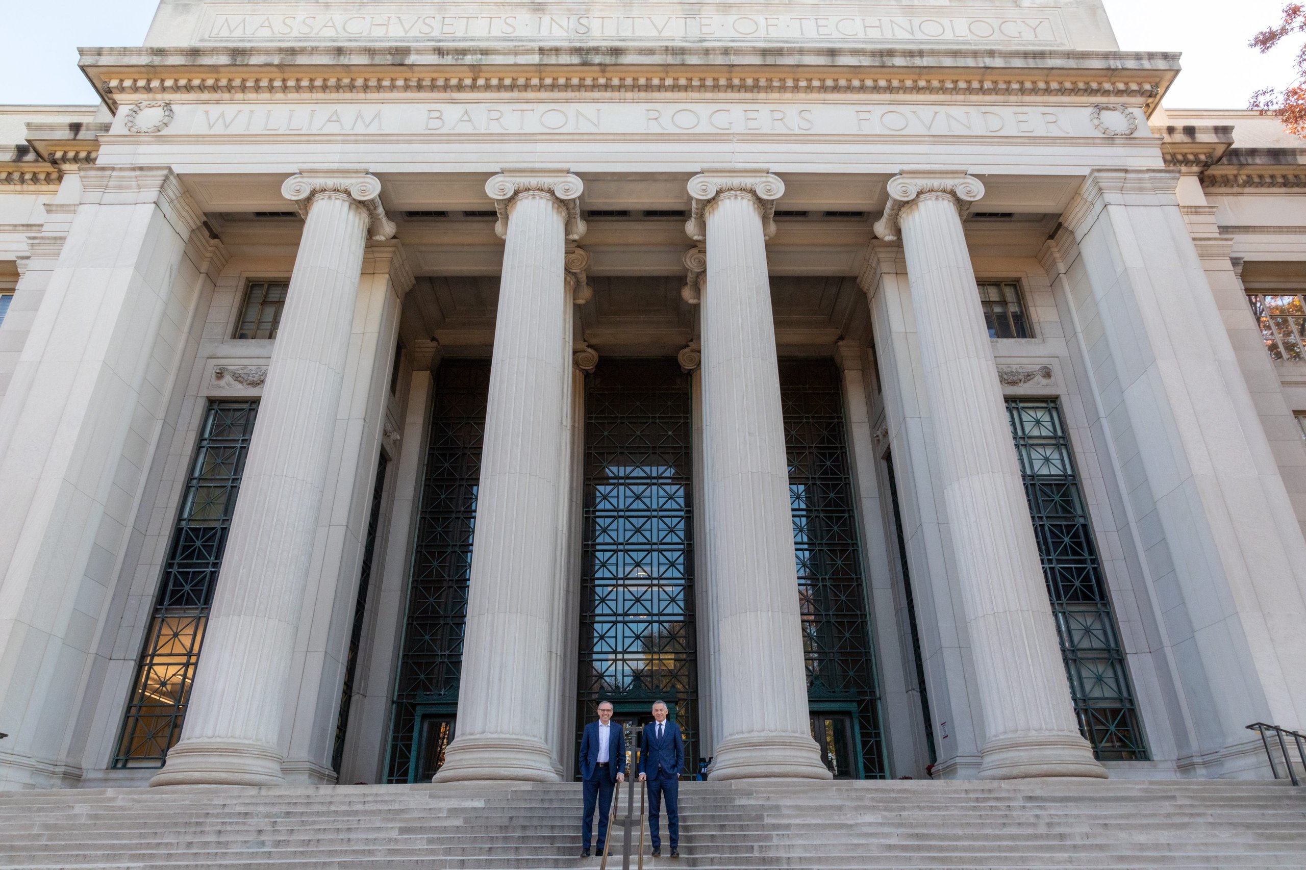 Lamborghini And Mit Patent A Supercapacitor Material That Could Reshape Hypercar Electrification 5 Two men in suits standing on the steps of mit's columned main building