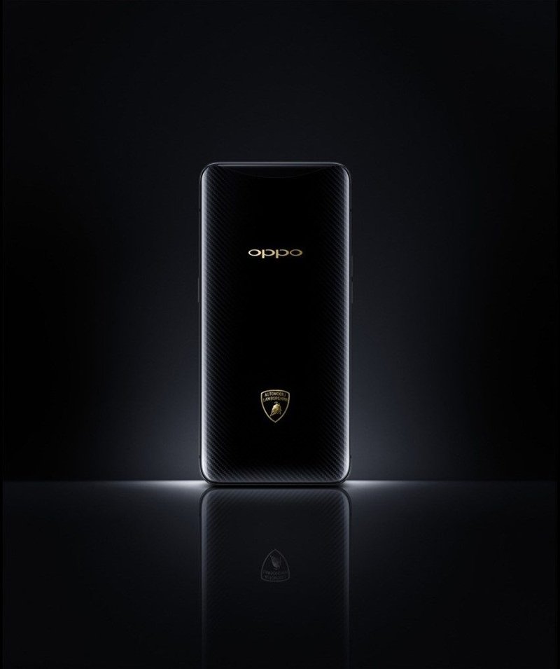 Close-up of the OPPO Find X Automobili Lamborghini Edition showing carbon fiber texture and gold shield logo