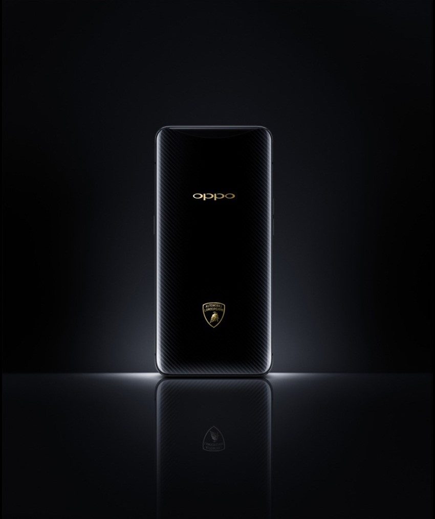 Close-up of the OPPO Find X Automobili Lamborghini Edition showing carbon fiber texture and gold shield logo