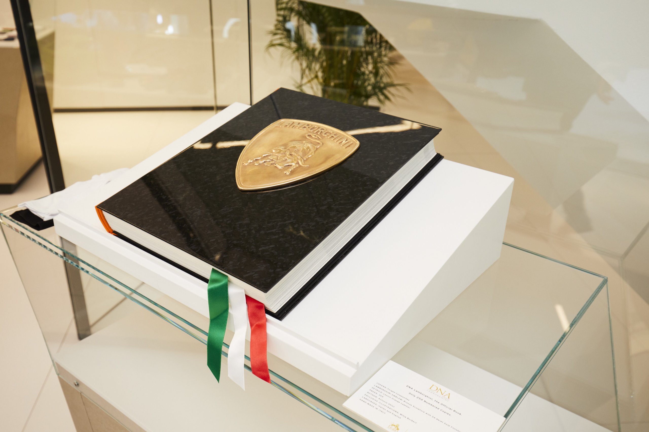 Lamborghini Unveils The Sián Fkp 37 At Iaa 2019: A Hybrid Tribute To Ferdinand K. Piëch 3 Large black commemorative book with golden lamborghini emblem and italian flag ribbon on display at iaa 2019