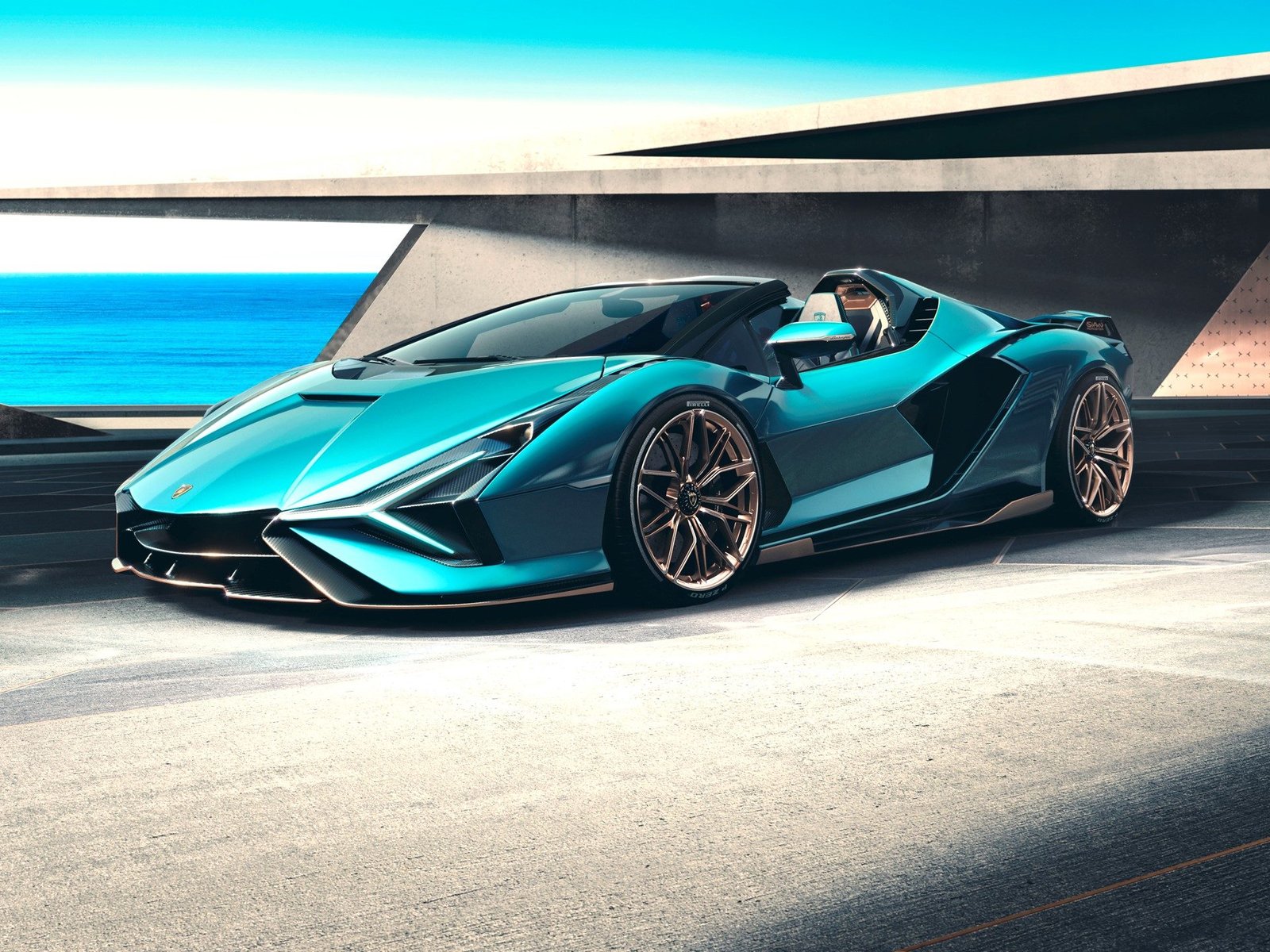 Lamborghini Sián Roadster in Blu Uranus showing open-top cabin, Y-shape headlights, and Oro Electrum bronze wheels against an ocean backdrop