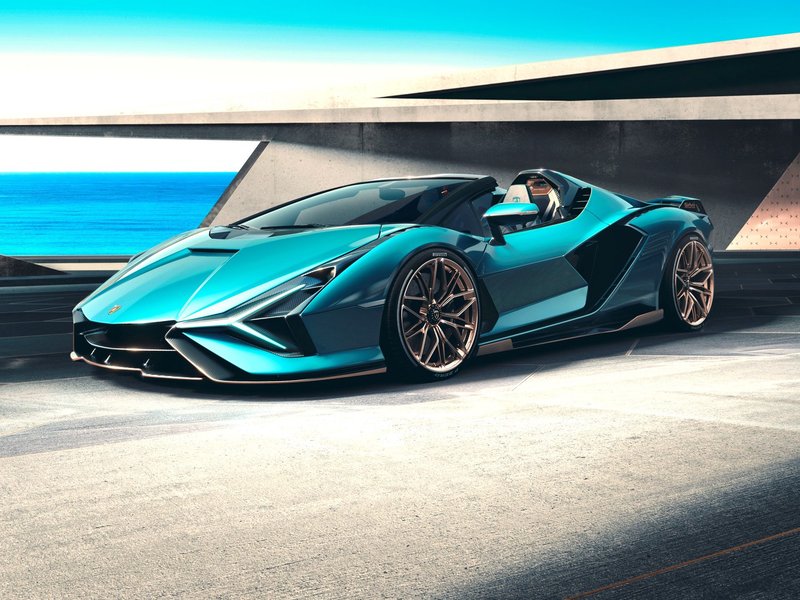 Lamborghini Sián Roadster in Blu Uranus showing open-top cabin, Y-shape headlights, and Oro Electrum bronze wheels against an ocean backdrop