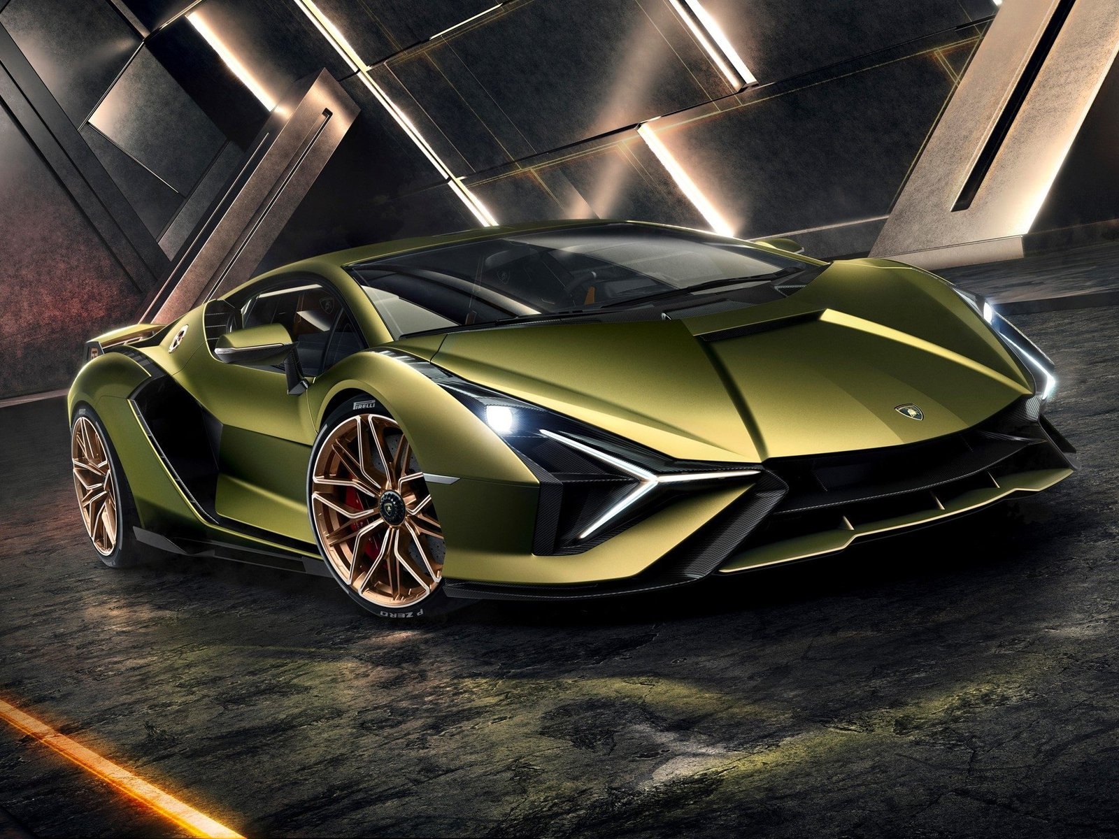 Front three-quarter view of the Lamborghini Sián FKP 37 showing Y-shaped headlights, angular front splitter, and bronze multi-spoke wheels