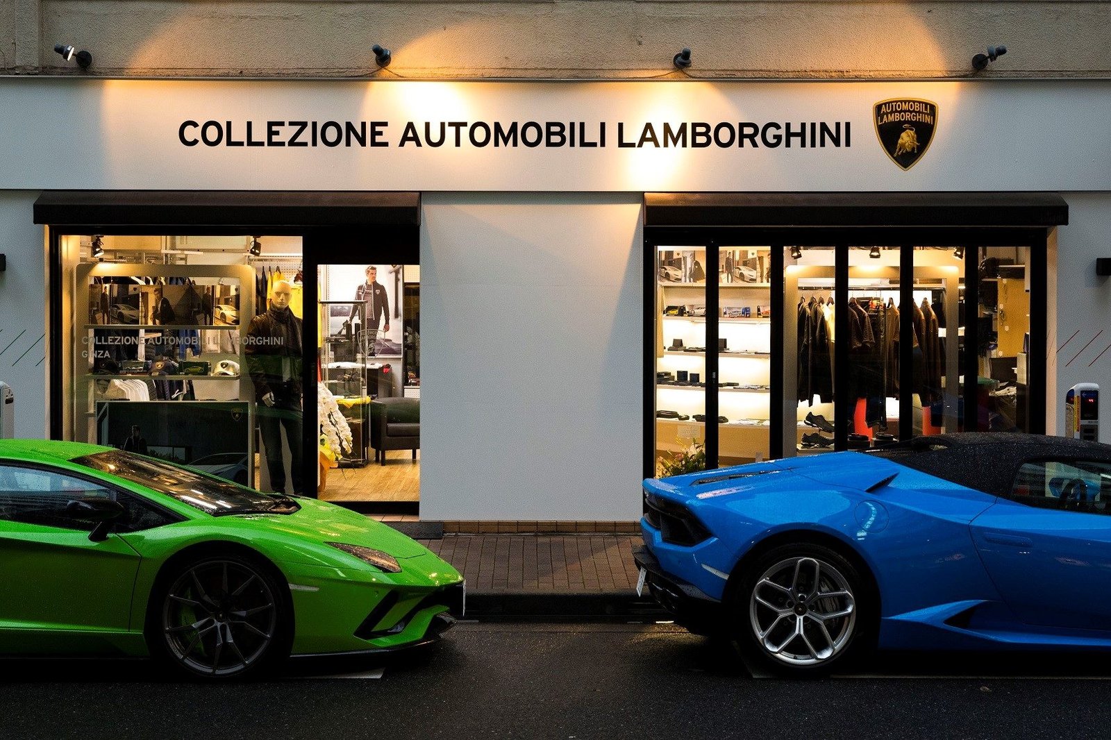 Green Lamborghini Aventador and blue Huracan parked outside the Collezione Automobili Lamborghini store in Ginza, Japan