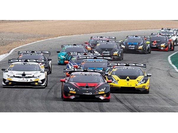 A pack of lamborghini huracán super trofeo evo race cars battle for position on track, displaying various racing liveries and prominent rear wings.