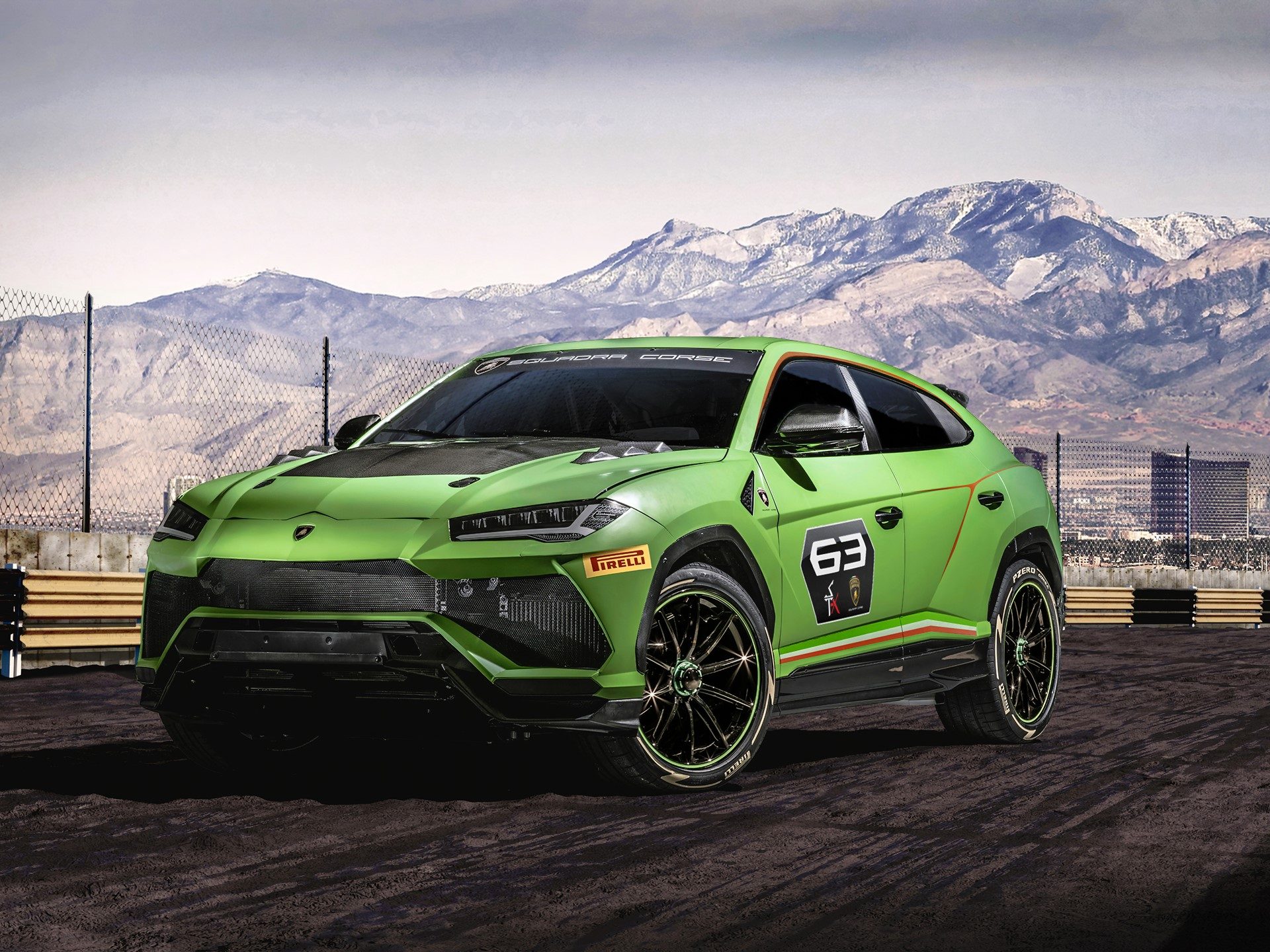 Lamborghini Urus ST-X Concept in matt Verde Mantis livery on a dirt track with mountains in the background