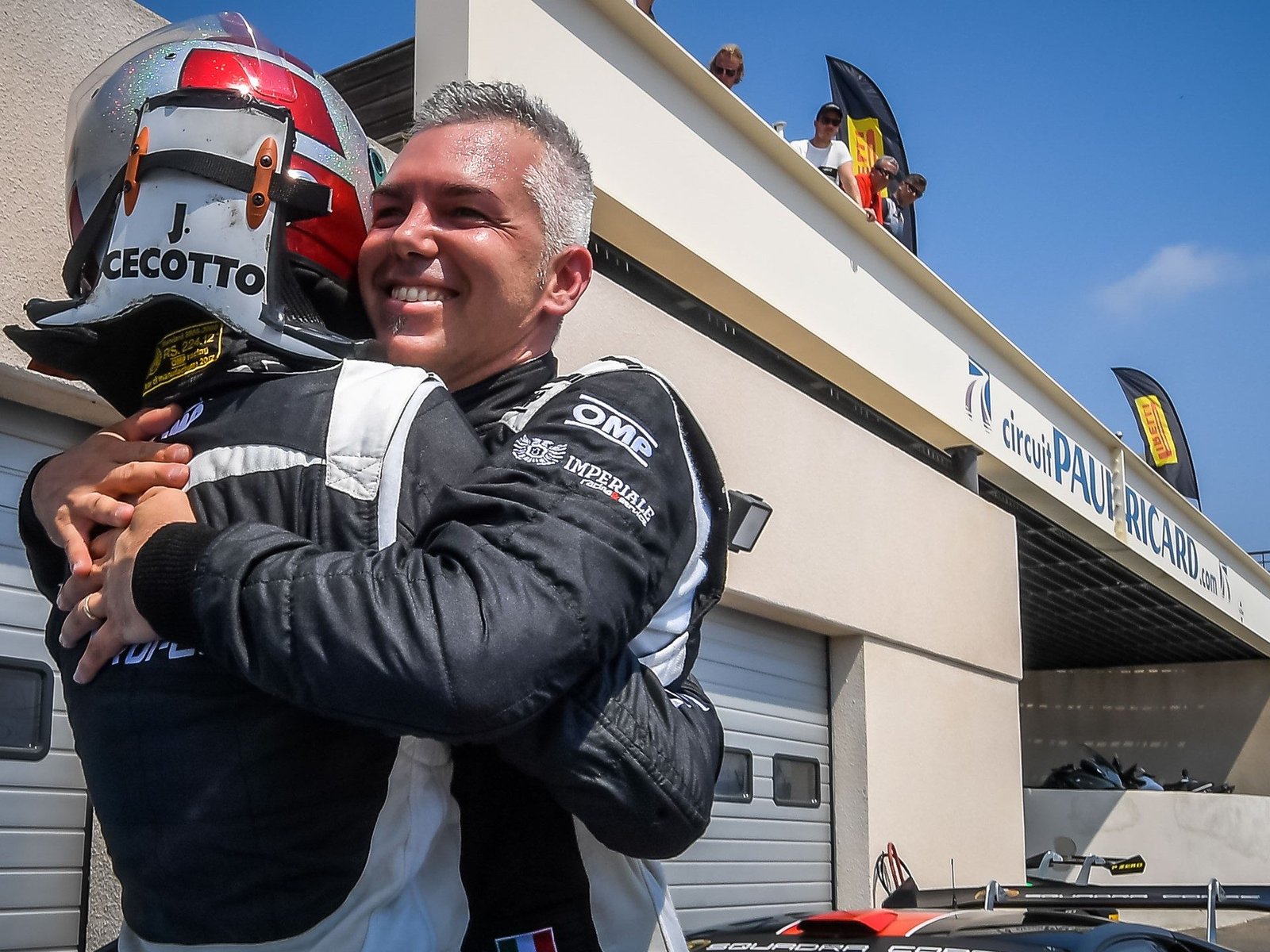 Two Lamborghini Super Trofeo drivers embrace in celebration after Race 1 at Paul Ricard