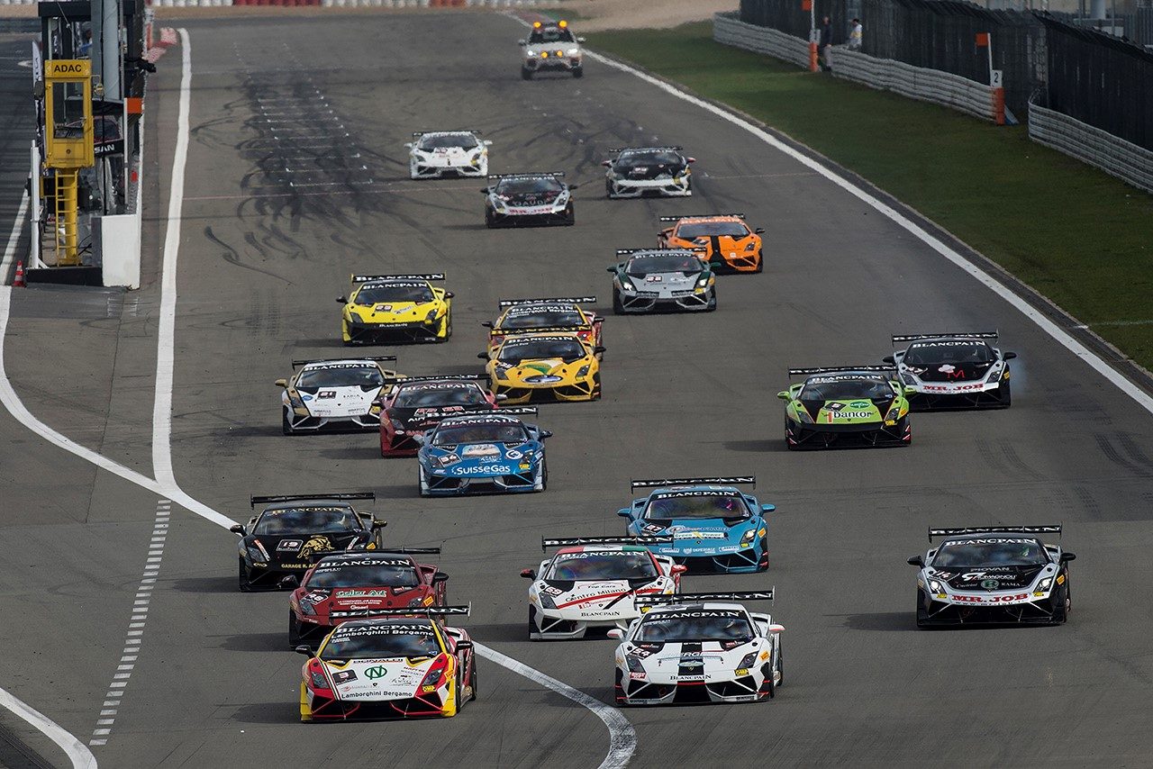 Aerial view of a tightly packed group of Lamborghini Gallardo Super Trofeo race cars in various liveries competing on track during the Blancpain Super Trofeo Europe series