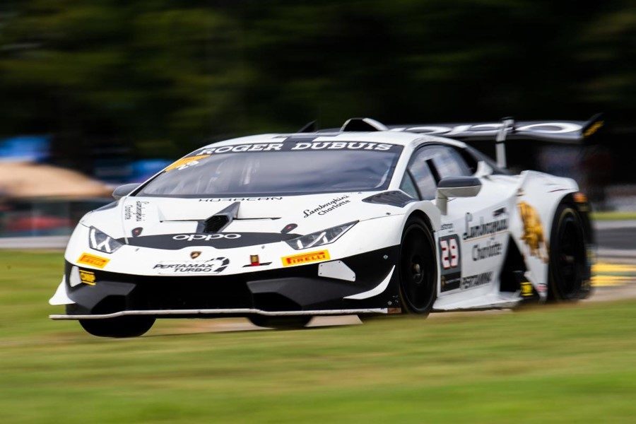 The no. 29 change racing lamborghini huracán super trofeo racing on track with visible large rear wing and front splitter
