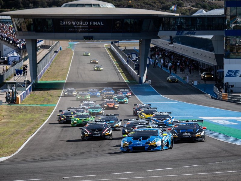 A packed grid of Lamborghini Huracán Super Trofeo Evo race cars battling on track at the Jerez de la Frontera circuit during the 2019 World Finals
