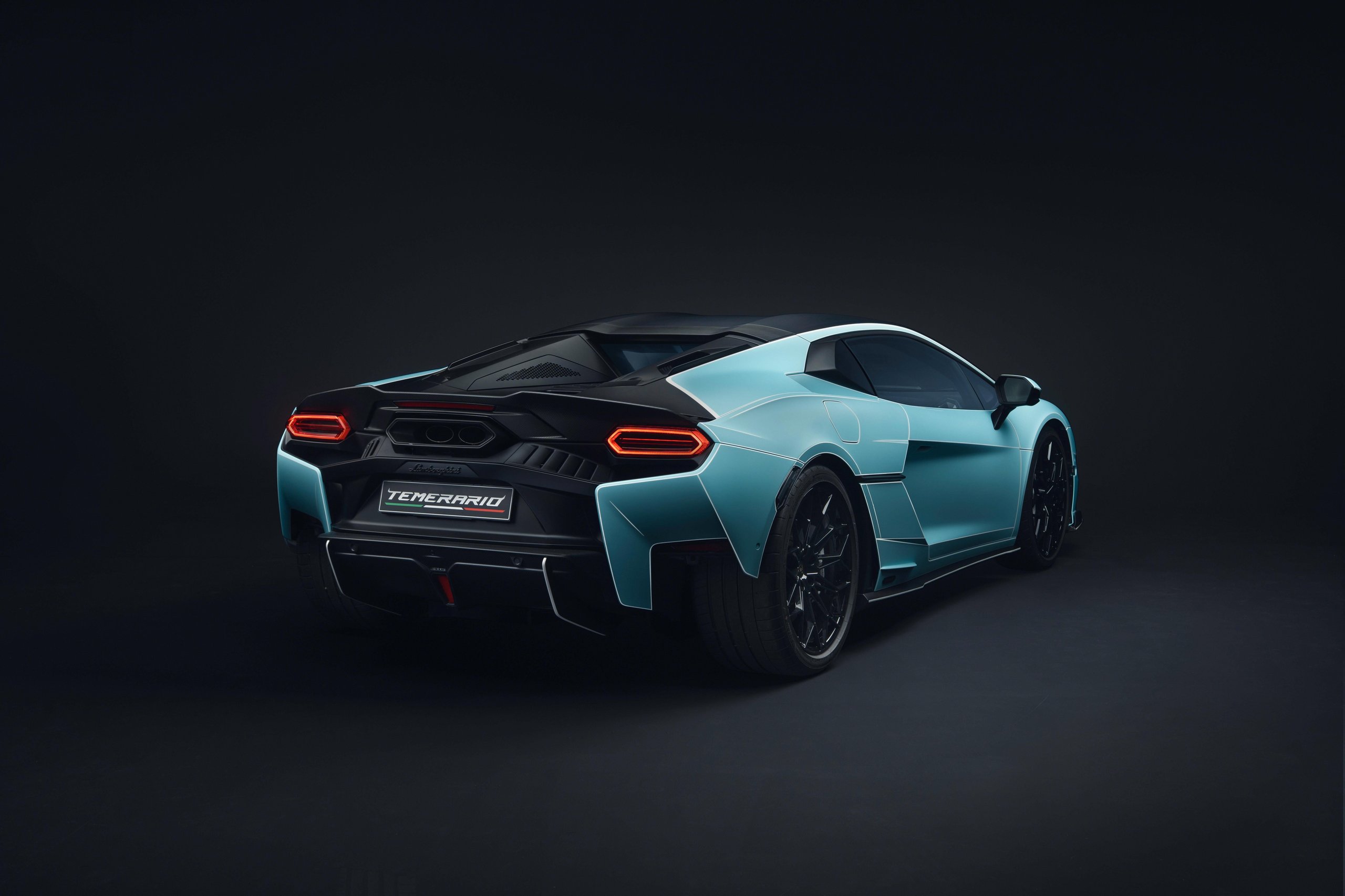 Rear three-quarter view of Lamborghini Temerario in Celeste finish showing aggressive diffuser and taillight design