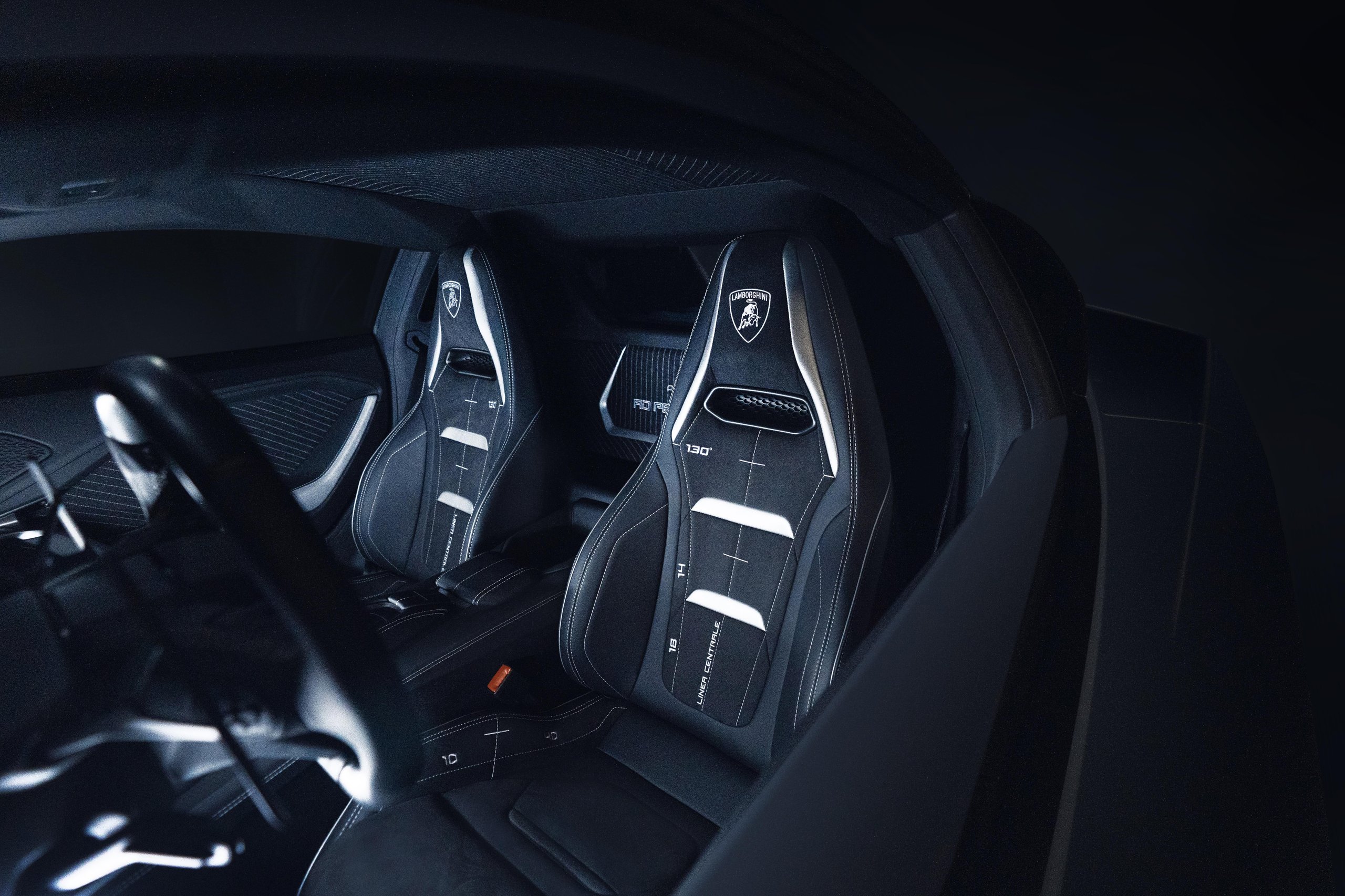 Wide interior view of Lamborghini Temerario showing black and white sport seats and cockpit design