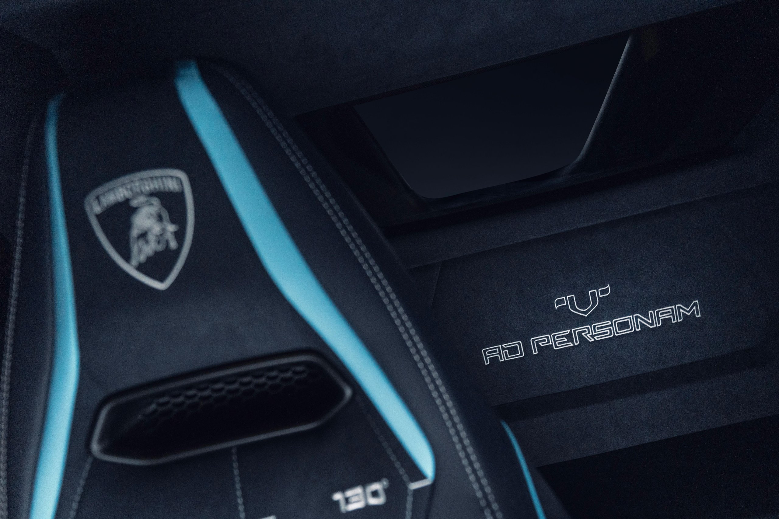 Close-up of AD PERSONAM inscription on Temerario interior door panel with bespoke stitching