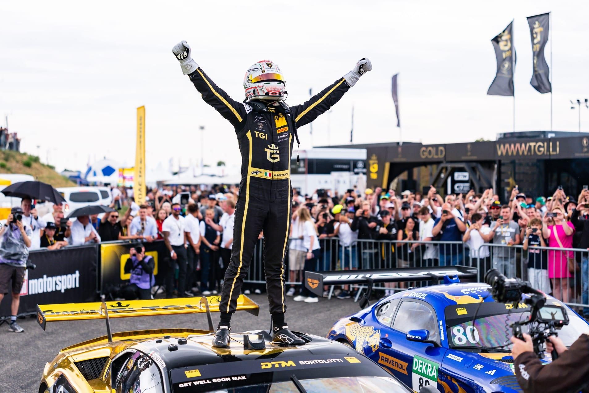 Temerario Gt3 Wins At Oschersleben: Lamborghini'S In-House V8 Racer Passes Its Biggest Test Yet 9 Mirko bortolotti standing on top of the temerario gt3 celebrating his victory with arms raised, fans cheering in the background