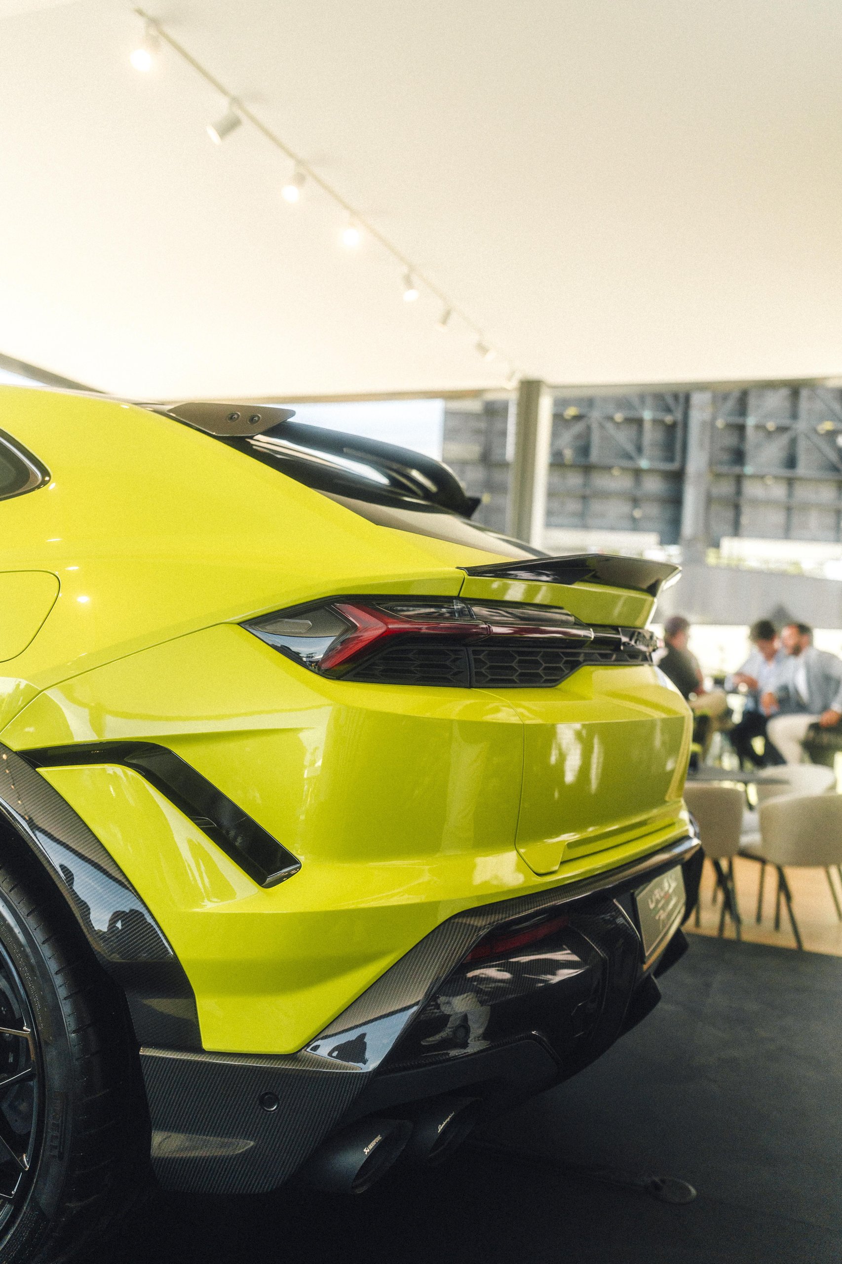 812 Hp In Verde Hydra: The Urus Se Performante Attacks Goodwood And Redefines What 'Performante' Means 5 Rear view of the lamborghini urus se showing carbon fiber rear diffuser, y-shaped taillights, and akrapovic exhaust tips