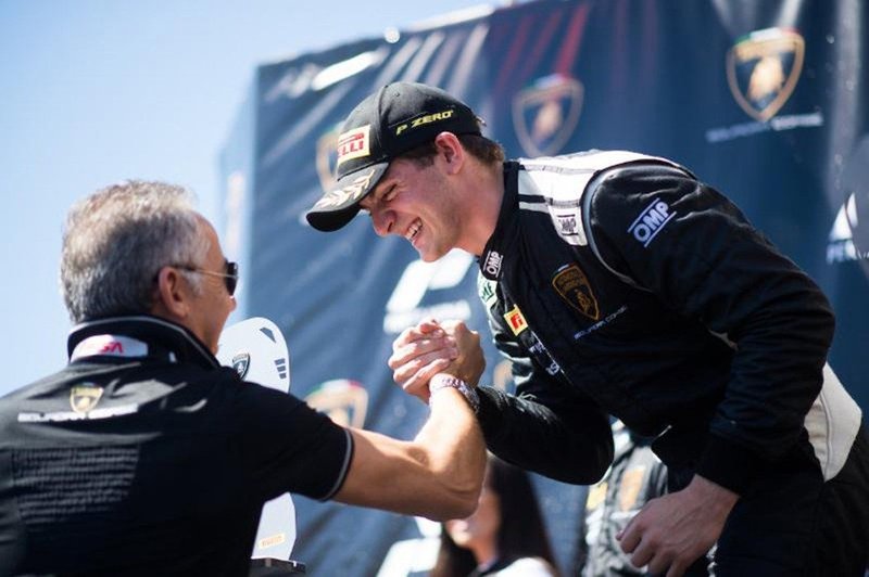 Austin Versteeg shakes hands with a team official after sweeping the Lamborghini Super Trofeo North America weekend at Laguna Seca in September 2017