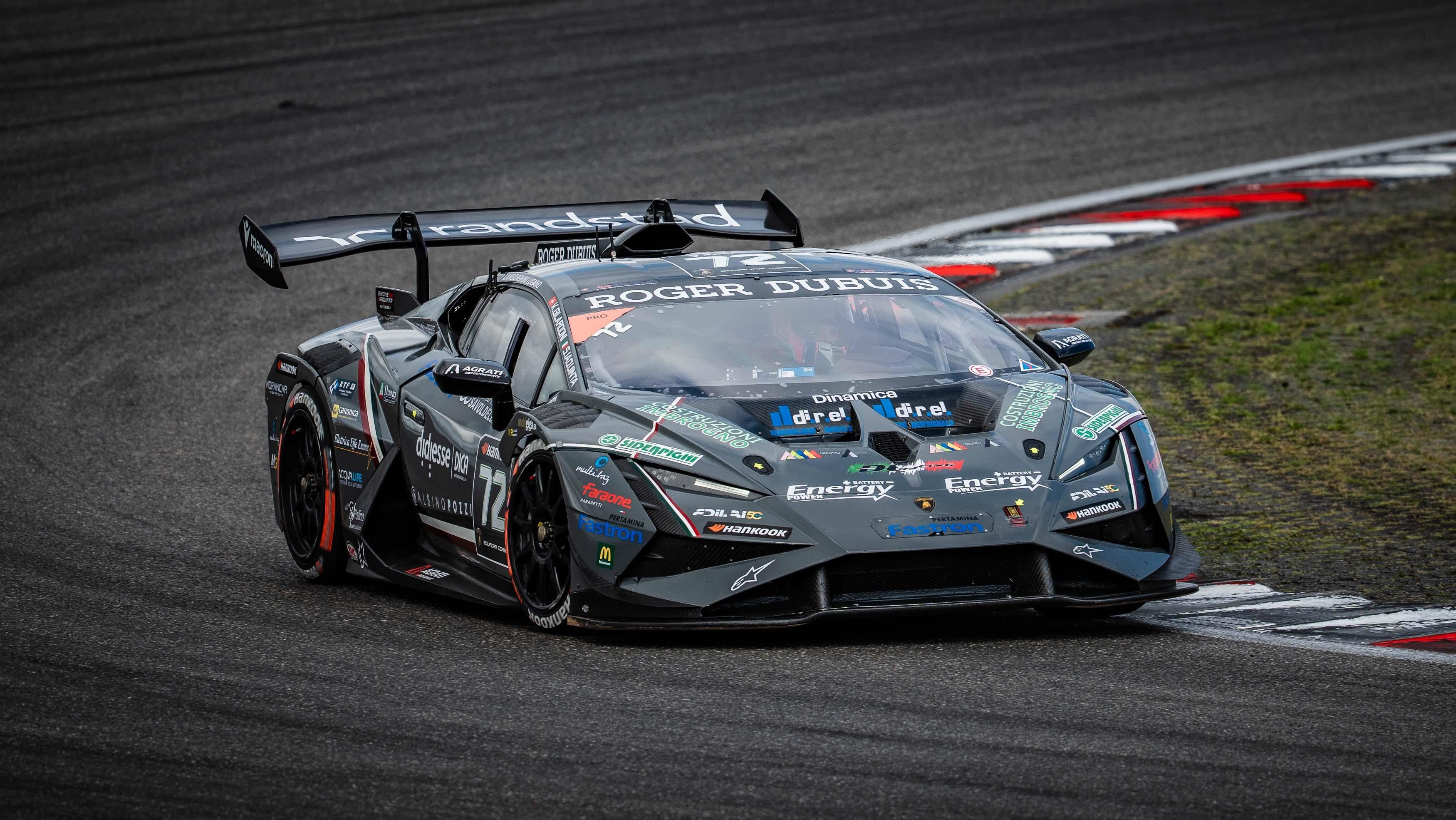 The grey #72 DL Racing Huracán Super Trofeo EVO2 navigating a corner at the Nürburgring with sponsor decals visible