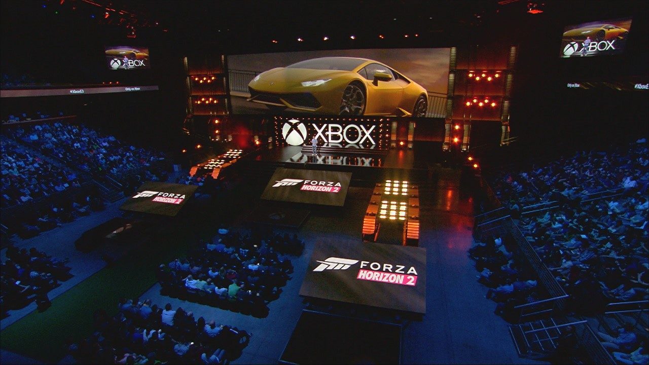 Yellow Lamborghini Huracán LP 610-4 displayed on a massive screen at the Forza Horizon 2 Xbox E3 event