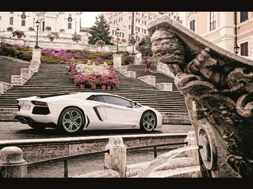 White Lamborghini Aventador parked on a historic Rome street with the Spanish Steps in the background during the 2013 Grande Giro