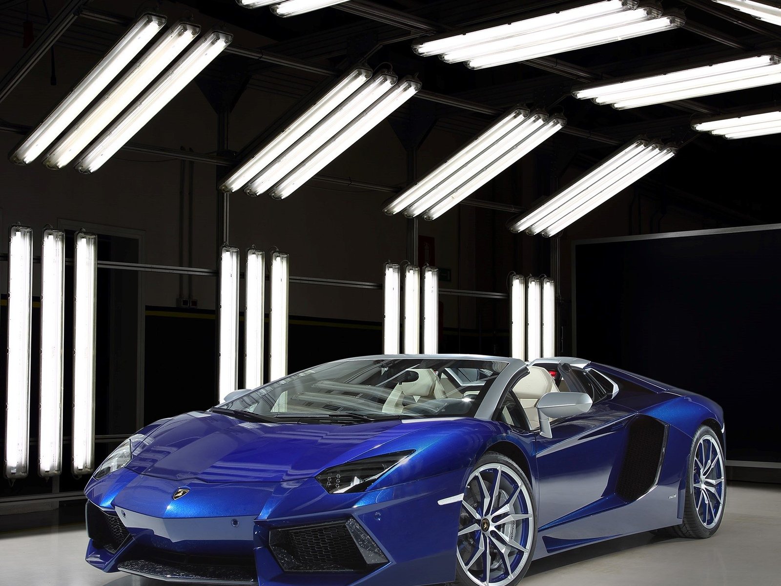 Blue Sideris Lamborghini Aventador Roadster showcasing Ad Personam customization in a studio setting