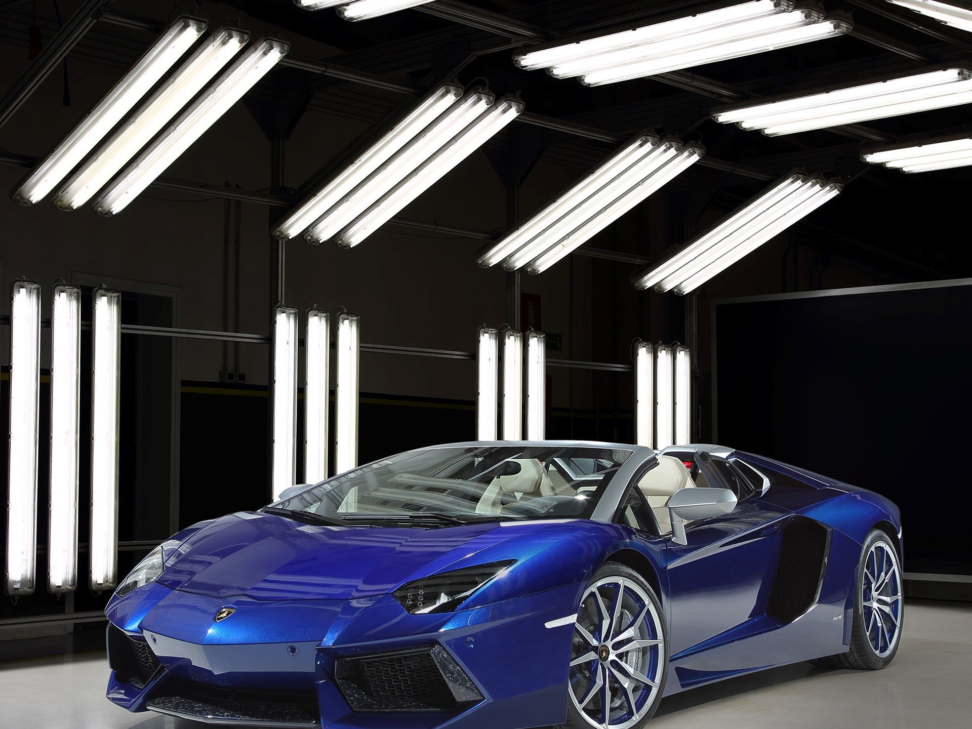 Blue Sideris Lamborghini Aventador Roadster showcasing Ad Personam customization in a studio setting