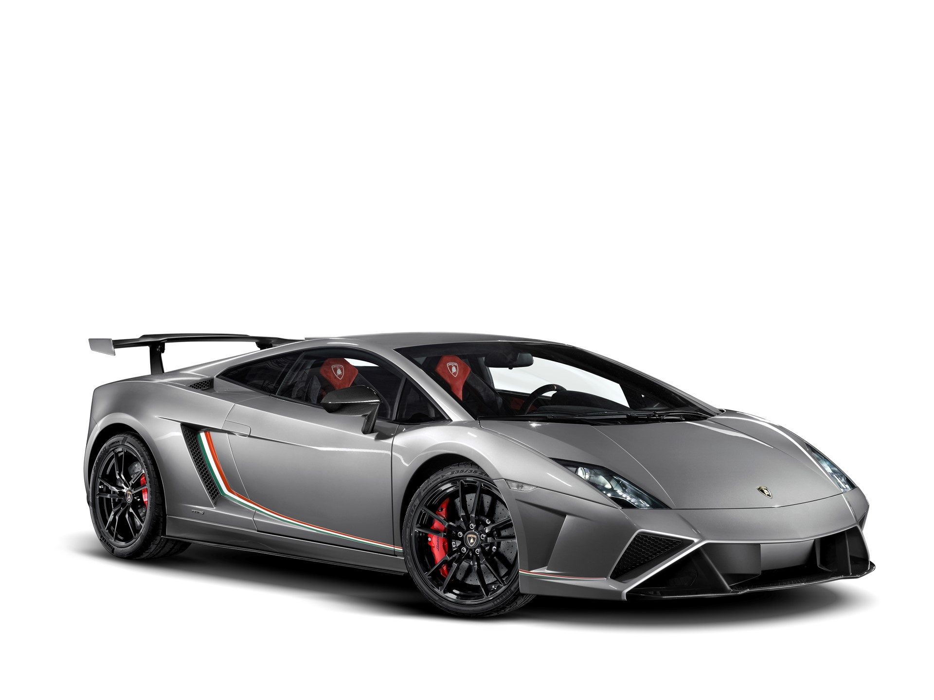Grey Lamborghini Gallardo LP 570-4 Squadra Corse with Italian flag side stripes, red brake calipers, and prominent carbon fiber rear wing in a studio setting