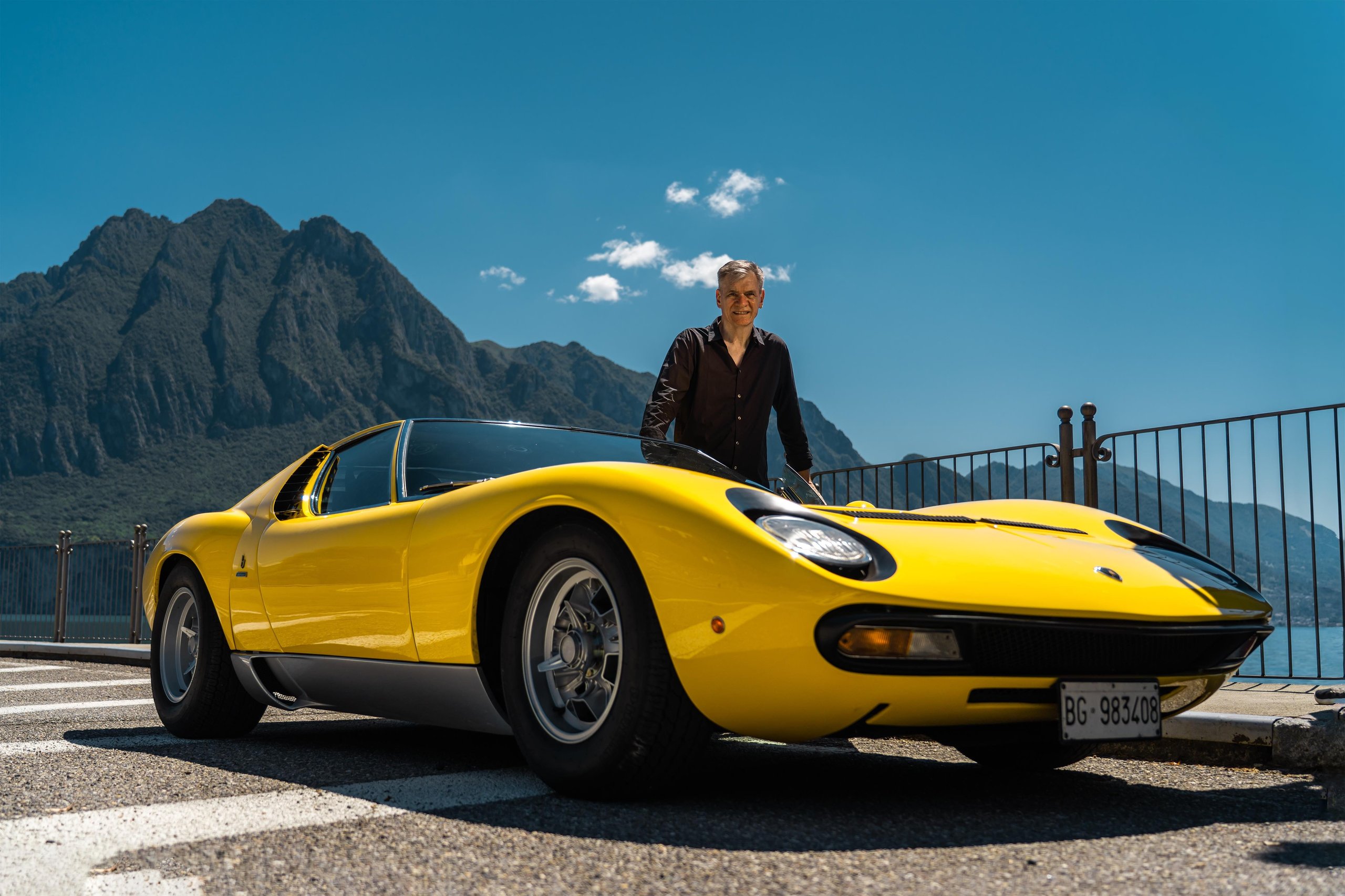 Lamborghini'S Miura Sv At 55: Why An Astronaut Behind The Wheel Says More Than Any Spec Sheet 1 Yellow lamborghini miura sv parked beside a mountain lake with astronaut paolo nespoli standing alongside