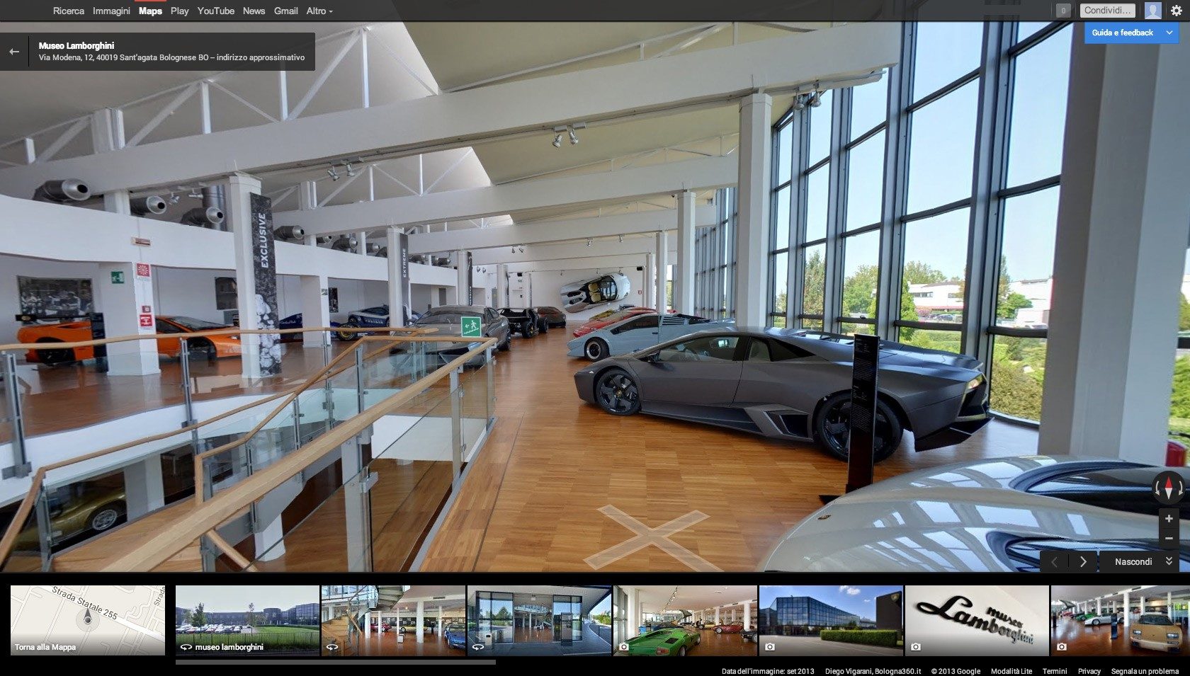 Interior of the Lamborghini Museum in Sant'Agata Bolognese showing a grey Reventón, orange Diablo, and light blue Countach on display under natural light