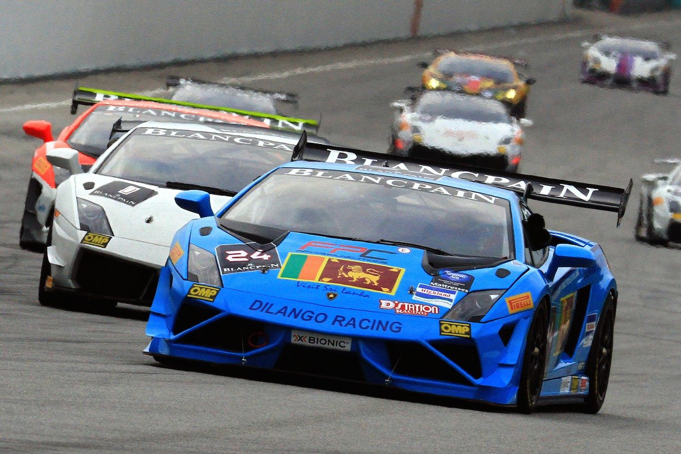 Blue Lamborghini Gallardo Super Trofeo race car leading a pack on track during the Blancpain Super Trofeo Asia Series