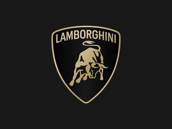 Close-up of the Lamborghini shield logo with the golden Raging Bull on a black background