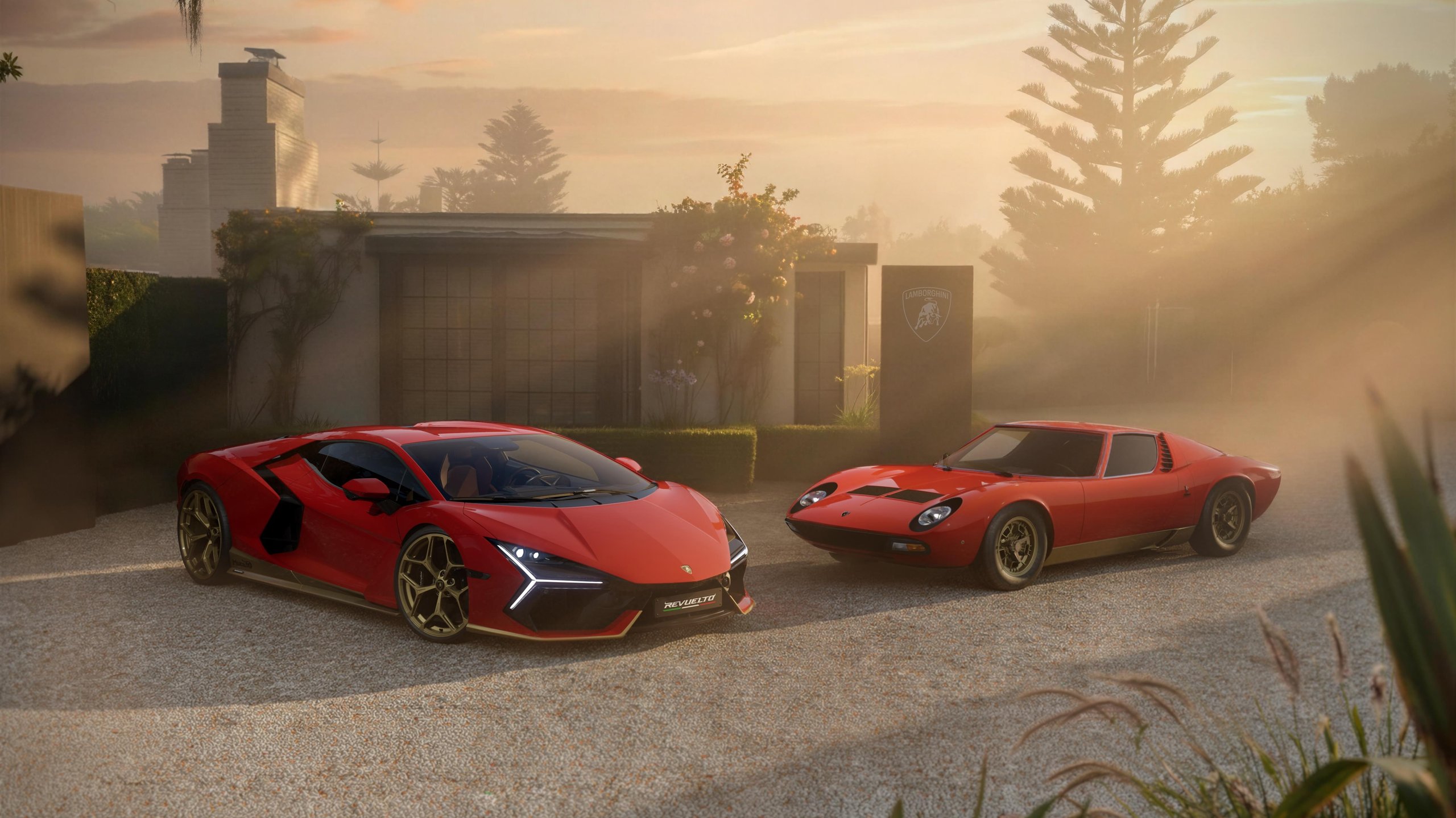 99 Units, Nine Heritage Colors, And One Very Specific Invitation: Inside The Revuelto Miura 60° Homage 2 Red lamborghini revuelto miura 60° homage parked alongside a red lamborghini miura on a gravel driveway at sunset