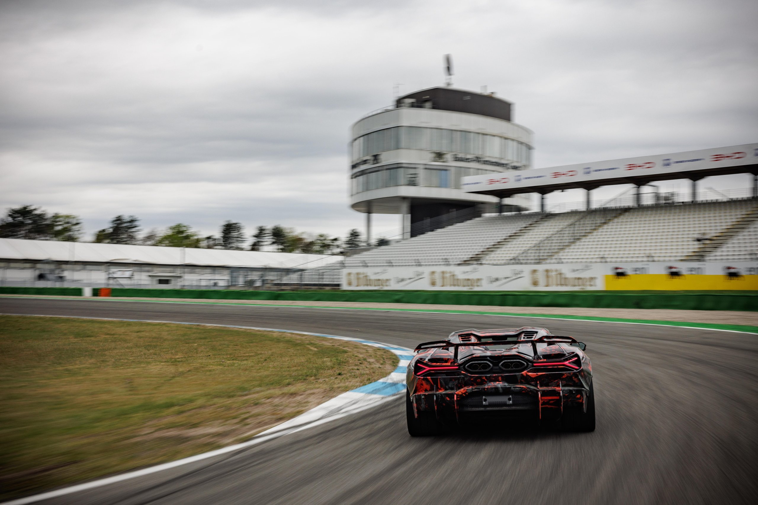 Revuelto Sv Claims Hockenheimring Production Car Record Before Anyone Even Knows Its Specs 2 Lamborghini revuelto sv prototype cornering on the hockenheimring with control tower and grandstands visible