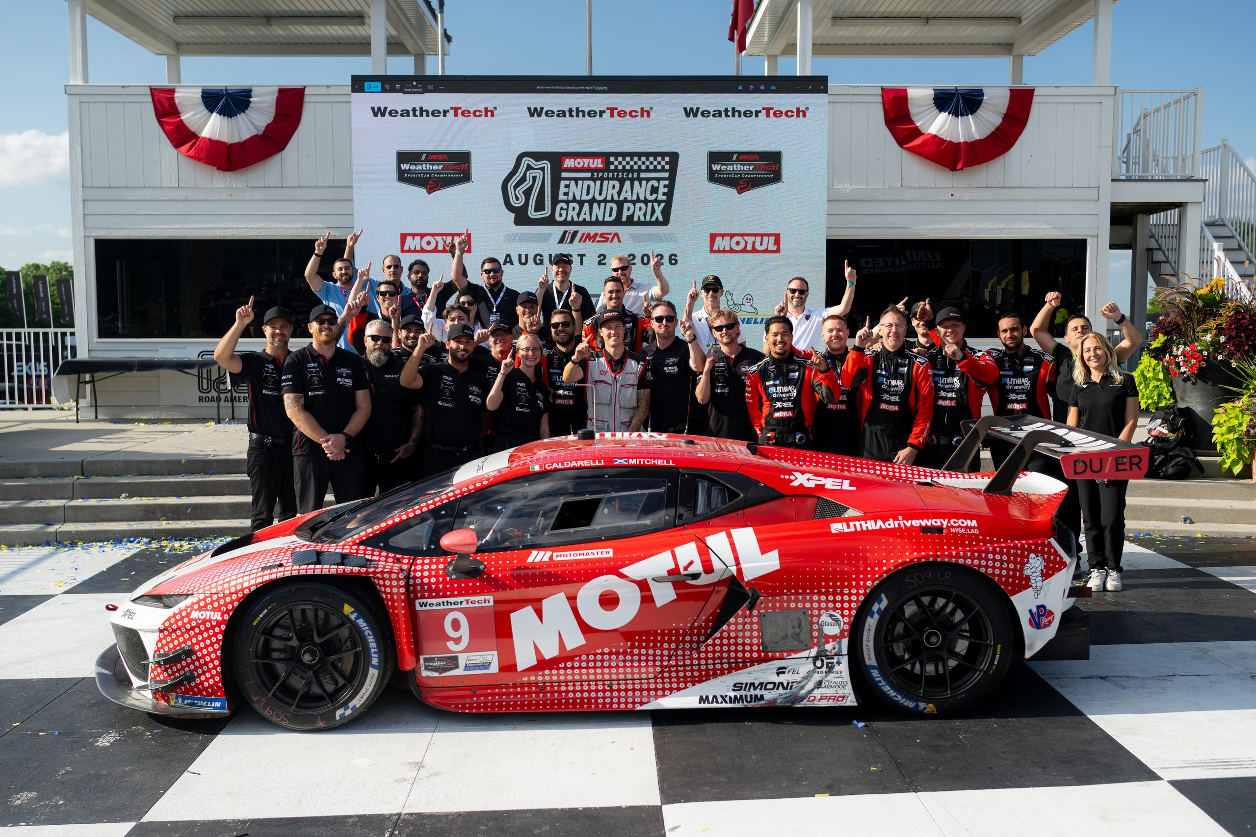 Temerario Gt3 Wins First Imsa Endurance Race At Road America, Five Months After Its Debut 1 The pfaff motorsports team celebrates around the red and white lamborghini temerario gt3 on the road america podium after its maiden imsa endurance victory