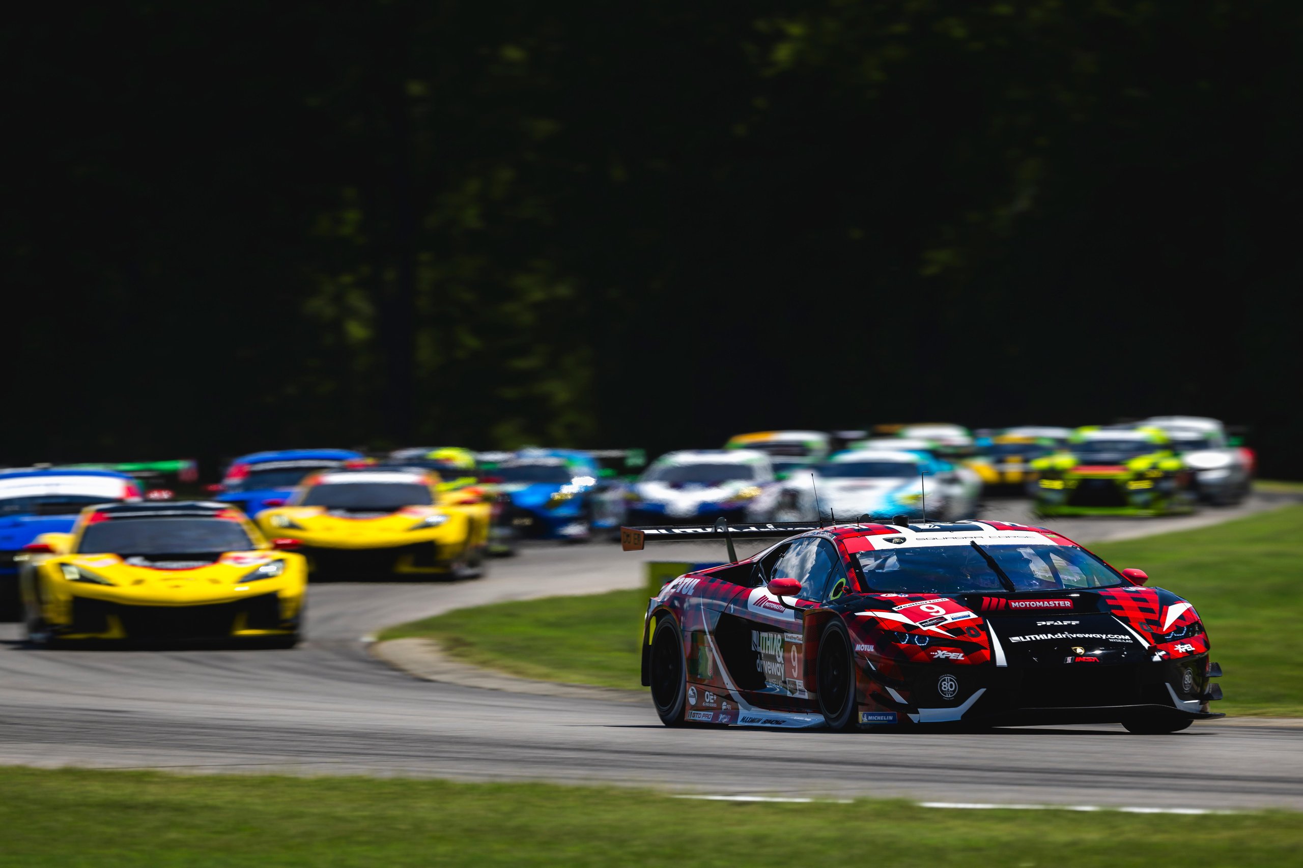 Lamborghini Temerario GT3 leading a pack of GT cars through a corner at Virginia International Raceway