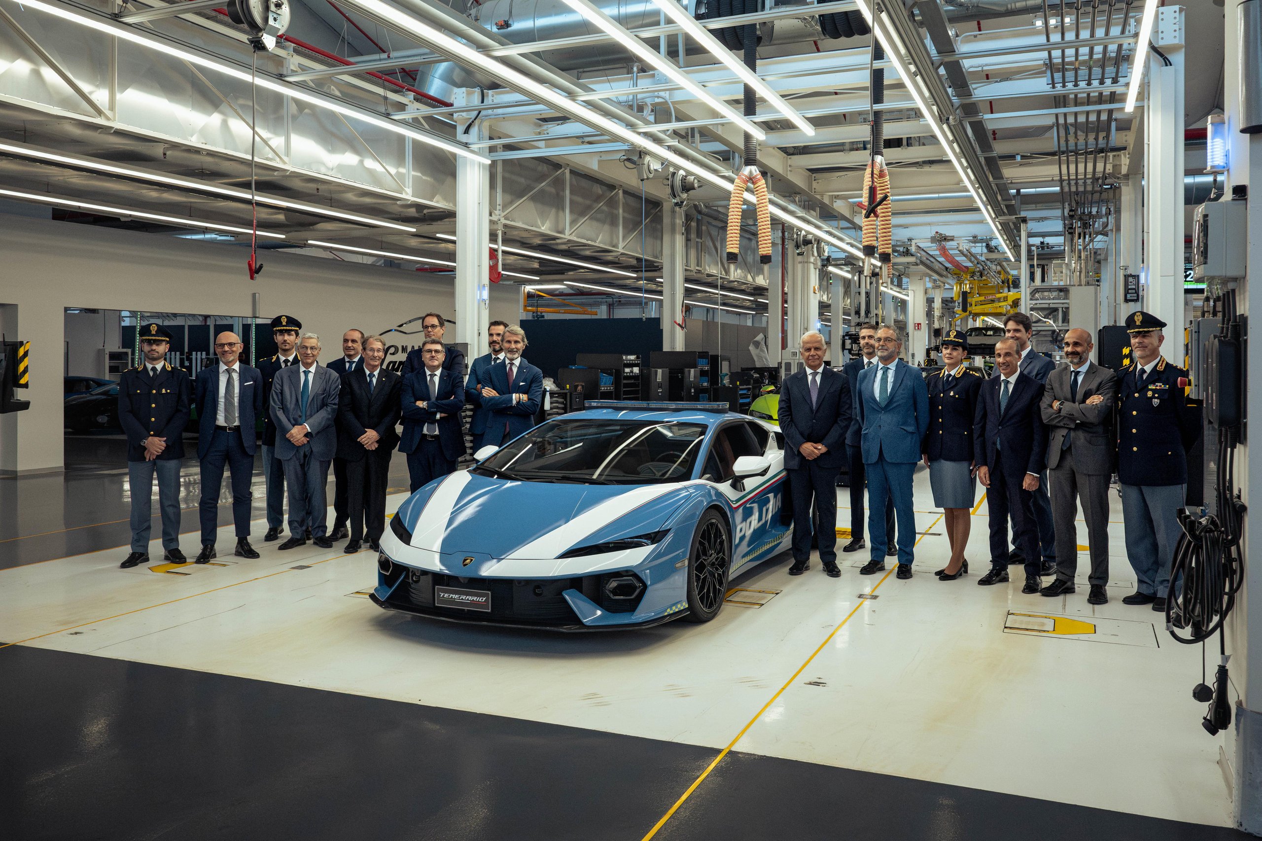 Lamborghini Temerario Polizia surrounded by a large group of police officers and executives at the Sant'Agata Bolognese factory