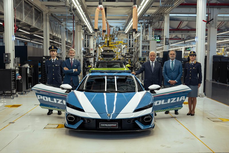 Blue and white Lamborghini Temerario Polizia displayed at Sant'Agata Bolognese headquarters with police officers and Lamborghini executives